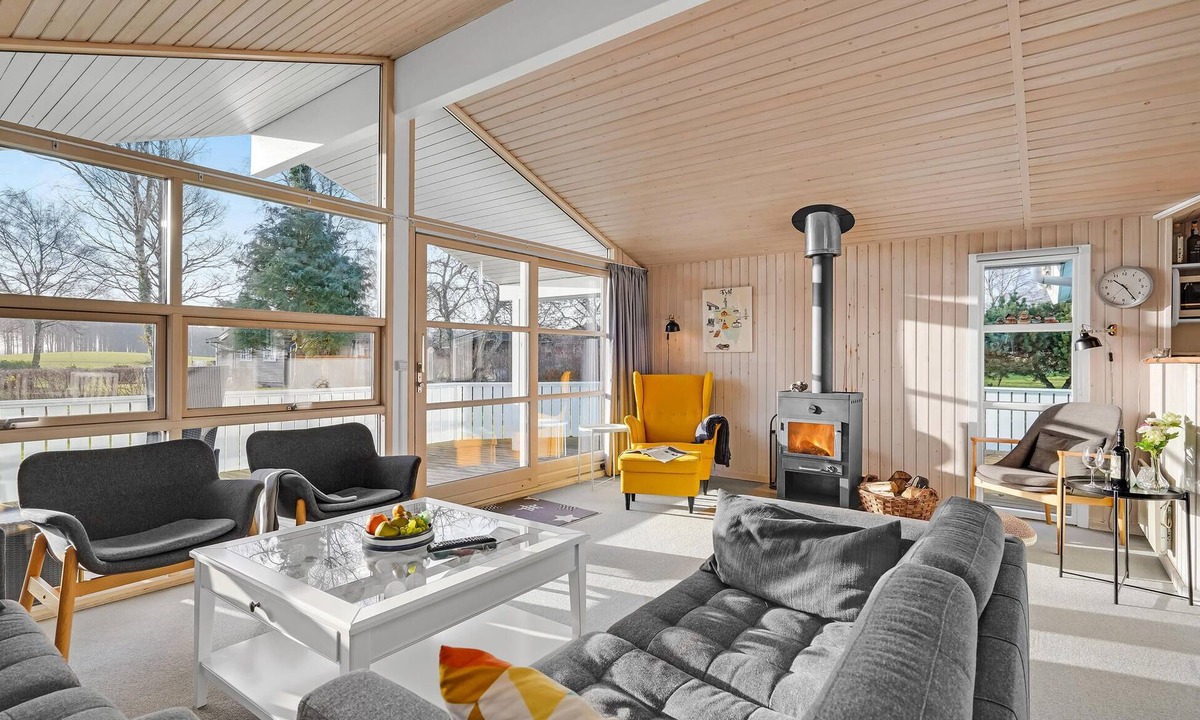 Østerskov House | This beautiful wooden house is located in a smaller cottage area, nestled in beautiful nature.