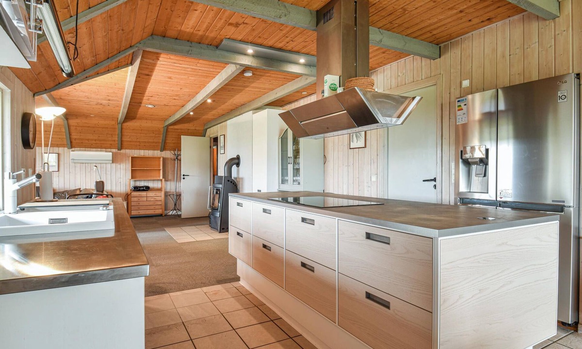 Houvig Strand House | This cozy cottage is located under a romantic thatched roof.
