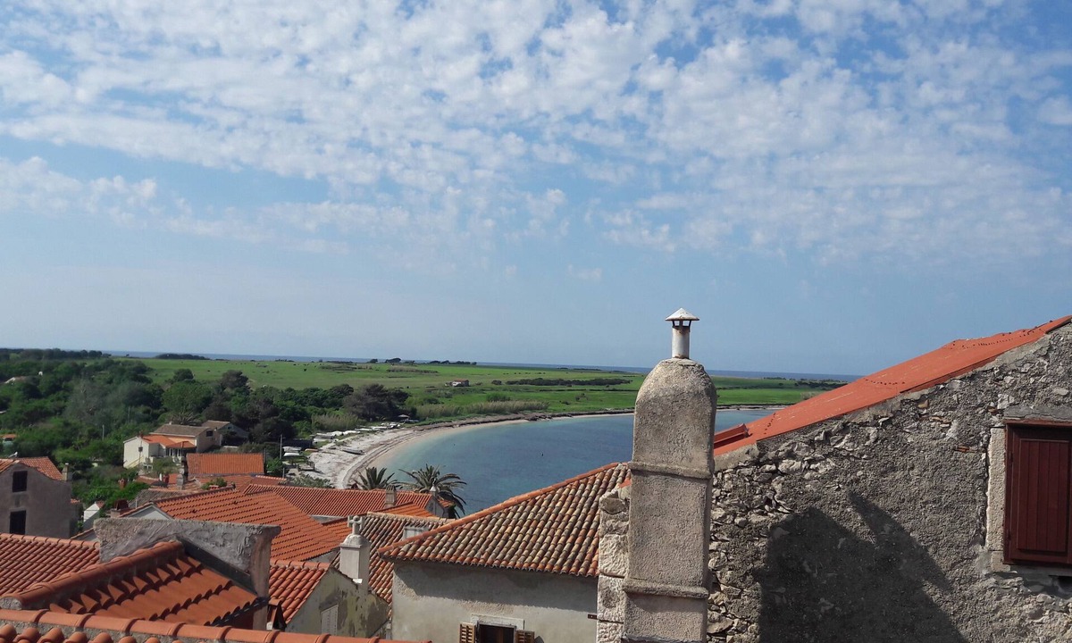 Unije House | This villa comes with a living room and a fully equipped kitchen.