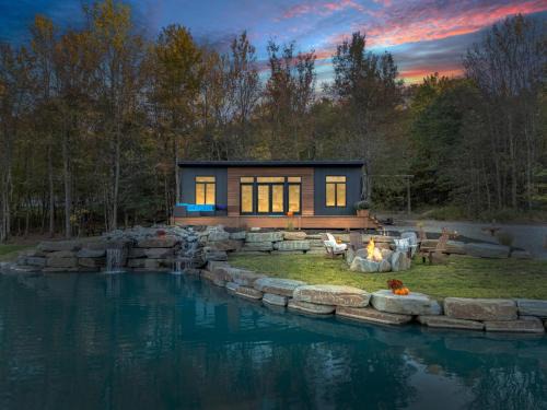 Brackney House | Tiny House on a Waterfall at Private Tiny Lake