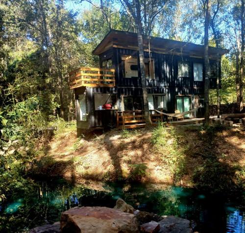 Plantersville House | Tranquil Creekside Container with Private Waterfall Near Renaissance Festival | Magnolia, Texas
