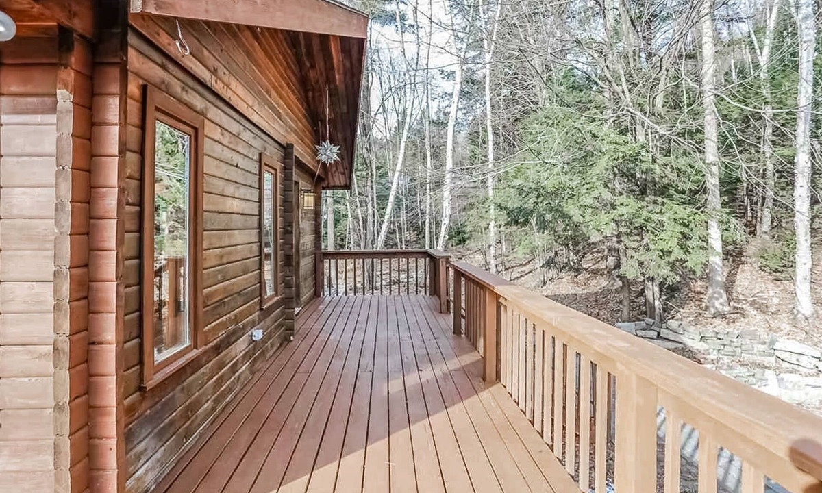 Raymond House | Tranquility, stone fireplace, lofted ceilings, wall of windows, & views