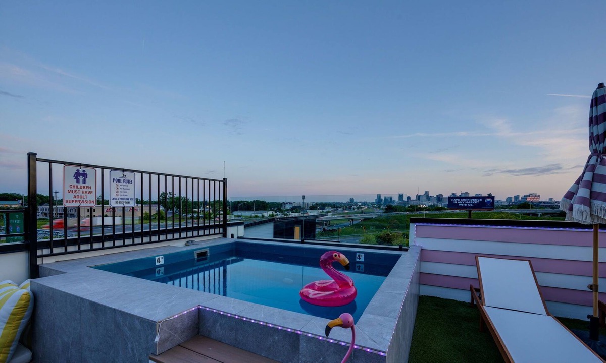 Katie Hill Neighborhood House | Ultra Heated Rooftop Pool! Arcade, Elevator, EV Charger, Sleeps 12, Full Home