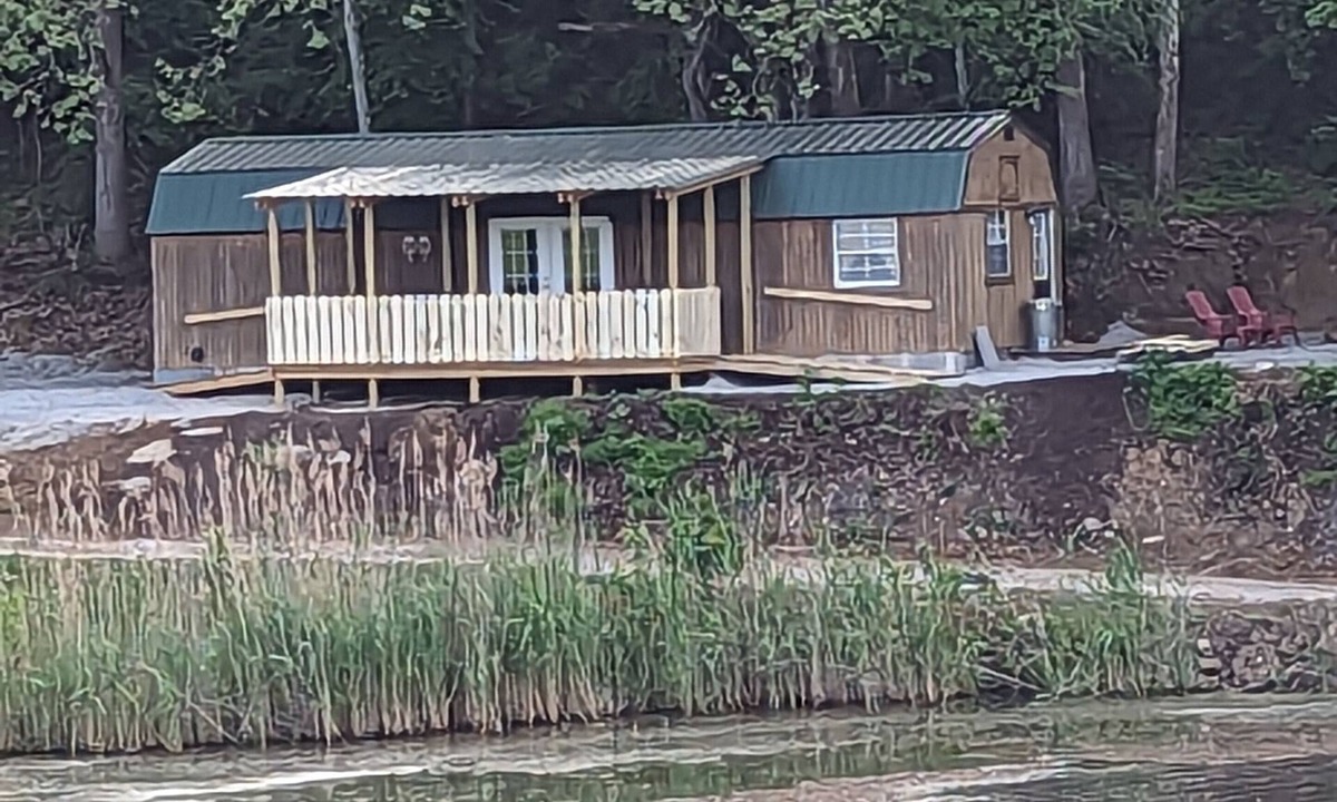 Jasonville Cabin | Unique cozy 14x40 Cabin with a nice deck by the water .