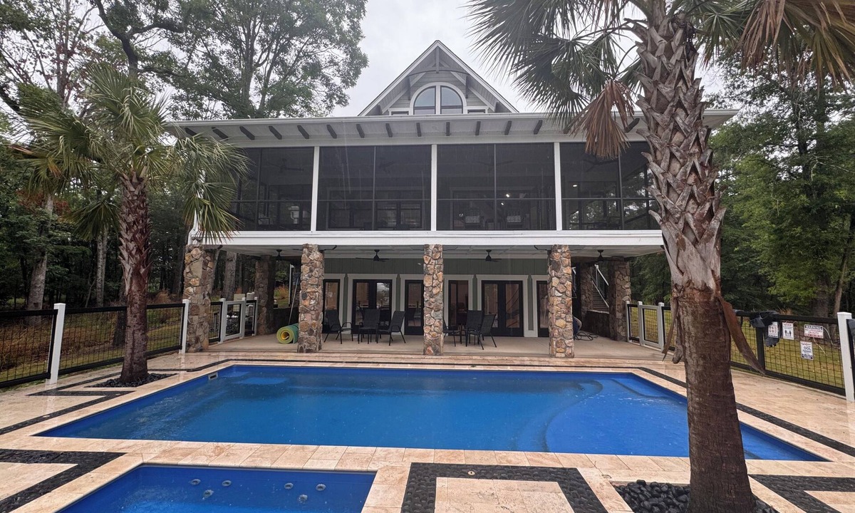 Huntcliff House | Unwind in Style: Premium Lakefront Oasis w Hot Tub, Dock, and Over-Water Sun Net