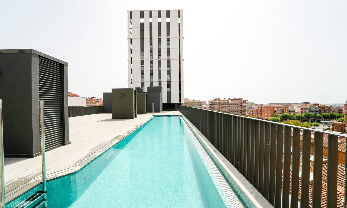 Cornella de Llobregat Apartment | Vacation Apartment "Sunsets & Pool in Barcelona" with Balcony, Shared Pool & Wi-Fi