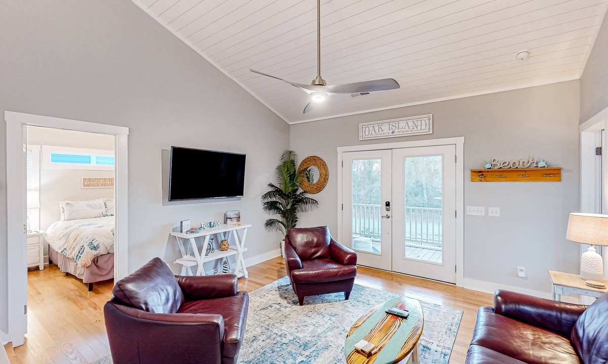 Tranquil Harbour House | Vibrant beach-themed stay with balconies, enclosed yard, extra kitchenette, & AC