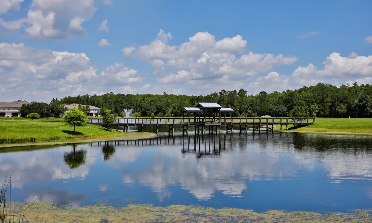 Trafalgar Village House | Water view retreat with lanai, heated pool, pool spa, game room, & AC