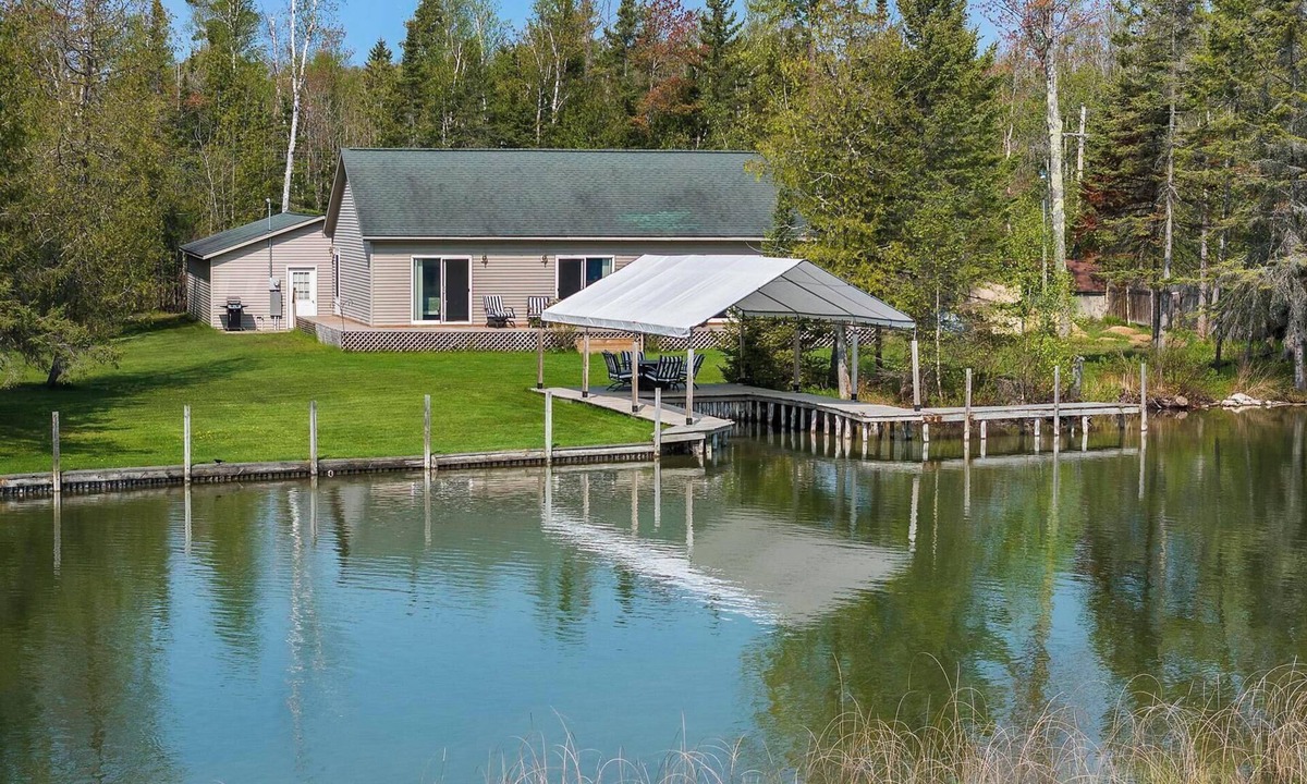 Alanson House | Waterfront Cottage with Covered Boat Slip