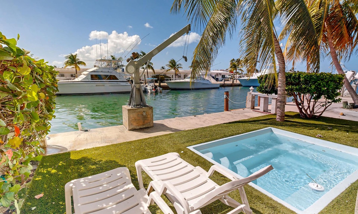 Key Colony Beach House | Waterfront Half-Duplex with 30-Ft. Dock, Sitting Pool, and Private Beach Access
