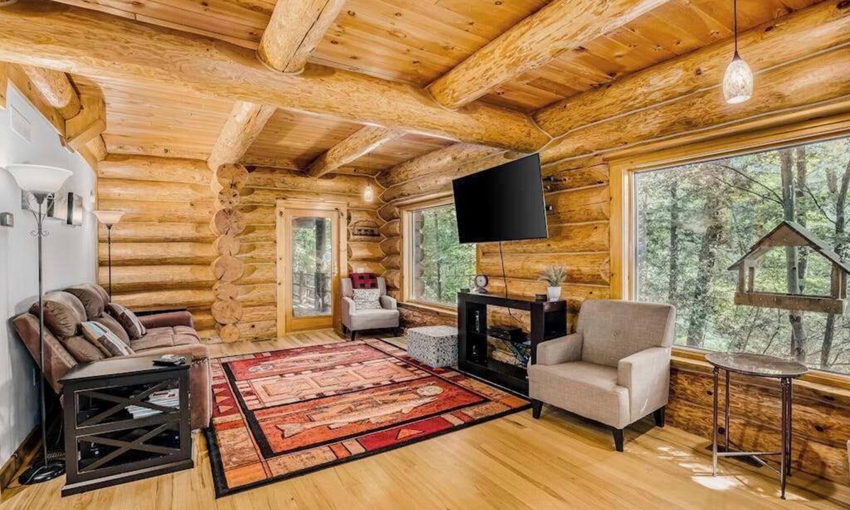 Thompsonville House | Waterfront home on Betsie River with hot tub & sauna near skiing at Crystal Mtn
