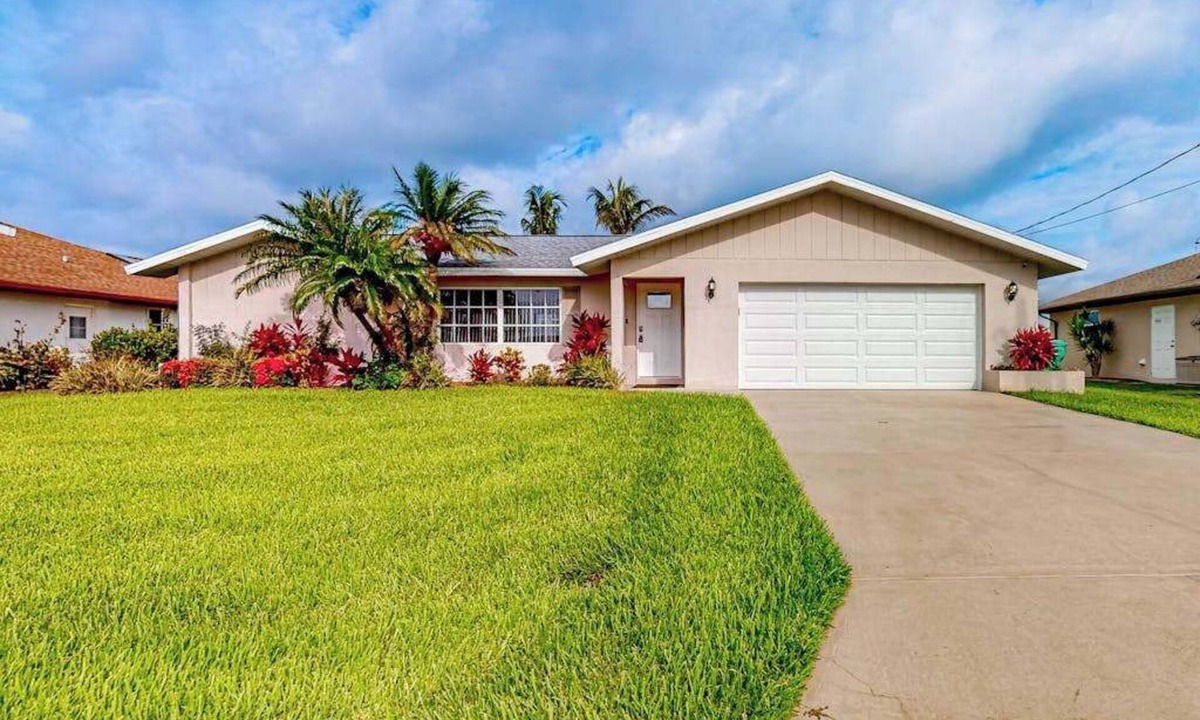 Gulf Cove House | Waterfront home with an enclosed pool, outdoor kitchen, and grill - dog-friendly