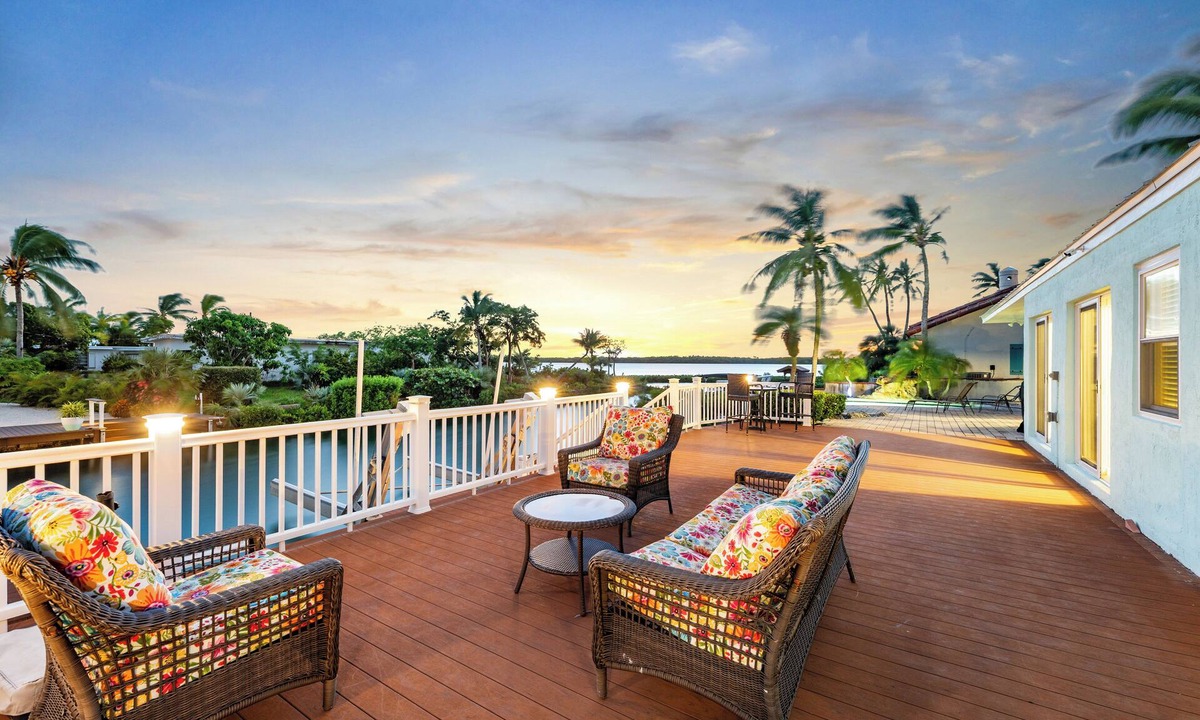 Cudjoe Gardens House | Waterfront home with a large dock, pool, and deck area. Can accommodate pets.