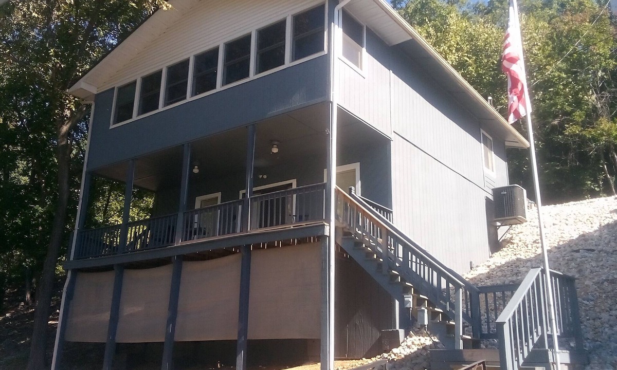 Lake of the Ozarks Cabin | Waterfront lake home, dock, quiet swim cove next to The Cave Restaurant + many
