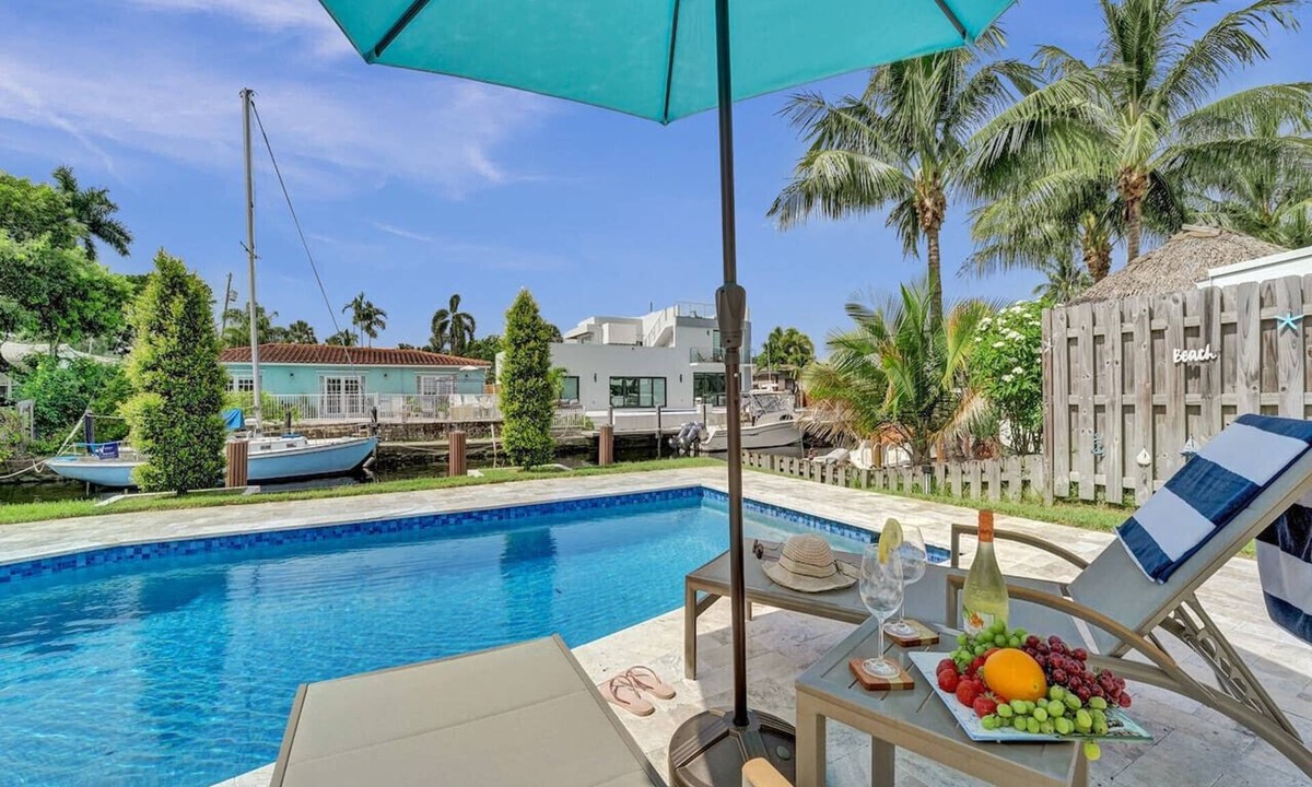 Citrus Isles House | Waterfront luxury pool home near FLL Airport.