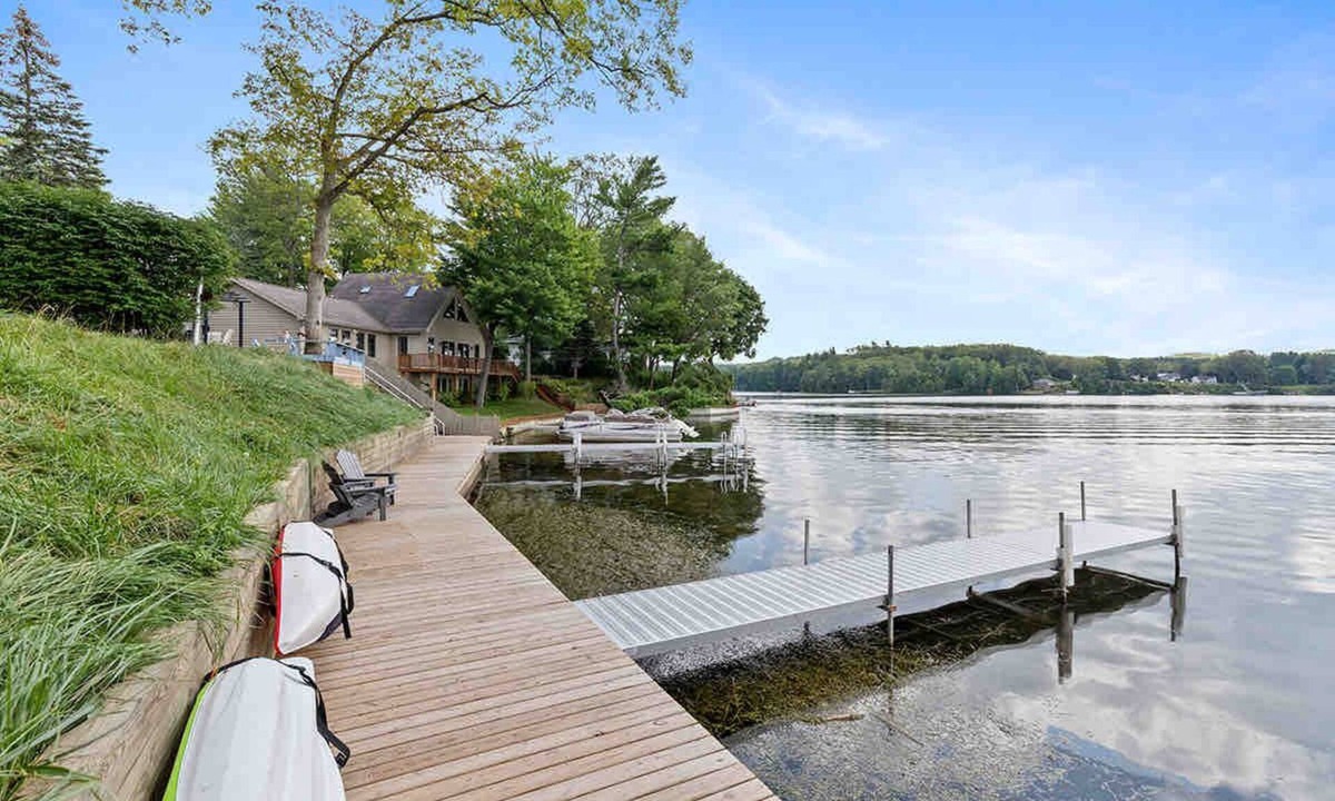 Newaygo Cottage | Waterfront Suite Dock, Kayaks, Firepit, BBQ