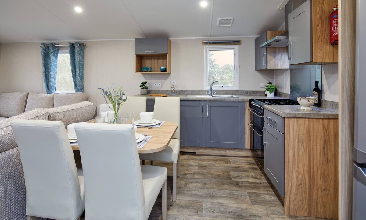 Dunbar House | Well appointed caravan with patio doors and decking.