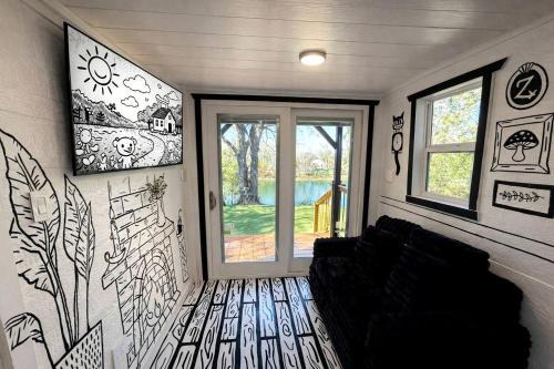 Paige House | Whimsical Lakefront Tiny Home with Hand-Drawn Doodle Design Near Bastrop, Texas