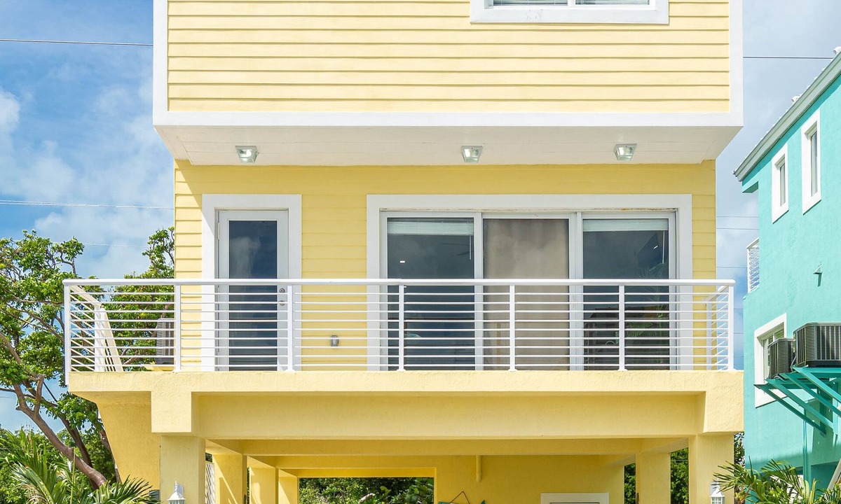 Sunrise Point House | Yellow 3 Story Home