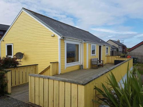 Shetland Islands House | Yellow house on the hill