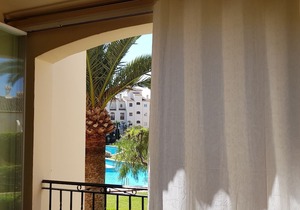 1 bedroom apartment with balcony overlooking superb communal pool and gardens