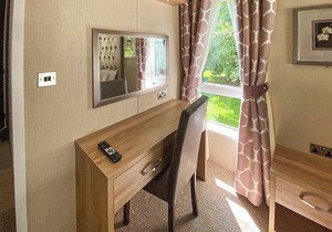 A spacious lodge with one master double with en suite shower room.