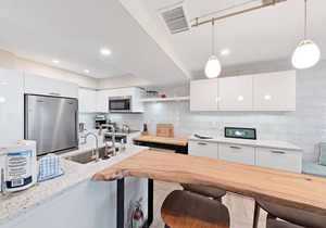 Beachfront condo with WiFi, two decks, Gulf views & pool - walk to the trolley