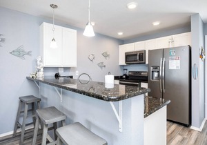 Beachside Condo Steps from the Sand with Pool, Hot Tub, and Private Balconies