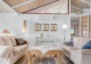 Beautiful, bright cottage with large wooden terrace and sea view.