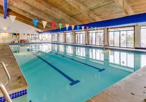 Bright townhouse-style condo with pools, hot tub, & sandy beach access