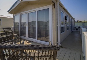 Caravan with decking at Broadland Sands in Suffolk ref 20294BS