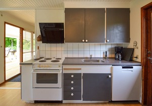 Classic, Danish cottage near the water.