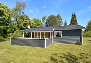 Classic, Danish cottage near the water.