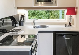 Contemporary mini pod with one double pull-out bed and en suite shower and W.