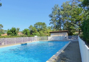 Cozy Villa Near Beach with Shared Pool, Patio, and Parking