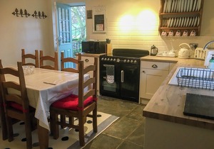 Detached barn conversion with side terrace overlooking the river.