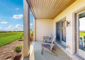 Dog-friendly oceanfront townhouse with covered balcony, views, pool & AC