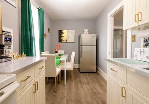 Emerald Oasis: Tremont 4BR Duplex by Christmas Story House | Patio, Laundry, Parking 7 Min Downtown