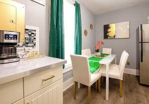 Emerald Oasis: Tremont 4BR Duplex by Christmas Story House | Patio, Laundry, Parking 7 Min Downtown