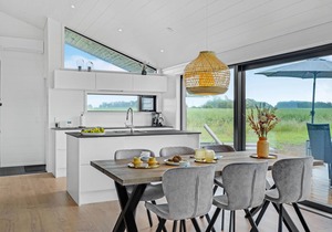 Here you can expect a modern vacation home with stylish interior and comfortable outdoor area.