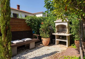 Holiday home with garden and barbecue