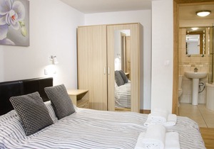 Home from home 5 bedroom chalet, log burner sauna and village location.