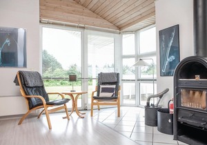 In a quiet vacation area near Lønstrup, this stone vacation home awaits you on a natural plot with p
