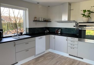 In the charming coastal town of Rågeleje, this lovely holiday home is located.
