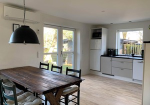 In the charming coastal town of Rågeleje, this lovely holiday home is located.