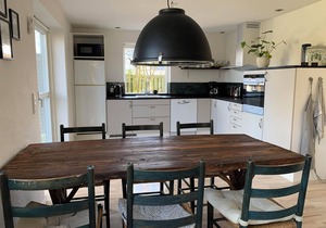 In the charming coastal town of Rågeleje, this lovely holiday home is located.