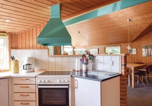 In the midst of beautiful nature on a large plot of land lies this lovely vacation home.