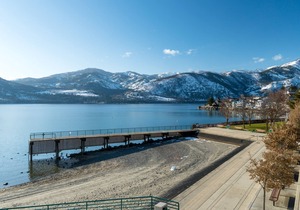 Lakeview home with wrap-around deck, easy lake access, private hot tub, & more