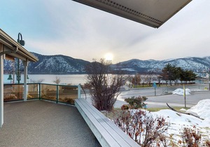 Lakeview home with wrap-around deck, easy lake access, private hot tub, & more