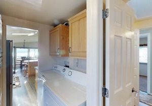 Lakeview home with wrap-around deck, easy lake access, private hot tub, & more